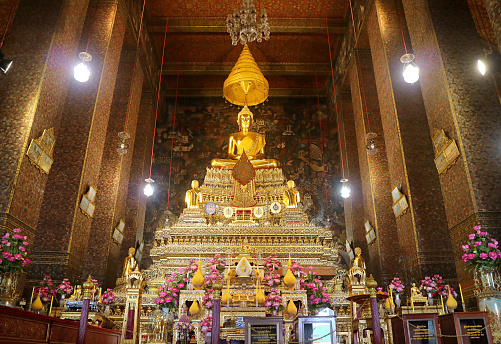 Phra Buddha Deva Patimakorn, Gorgeous Buddha Image Sitting on the Three-tiered Pedestal with Amazing Mural in Backdrop, Wat Pho Temple, Historic Temple in Bangkok, Thailand