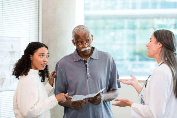 istock As doctor explains, man and granddaughter question information in brochure 1368252364
