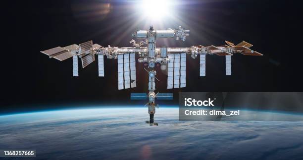 Orbital Space Station On Orbit On Dark Background Iss Floating In Space Near Earth Planet Space Scifi Collage Astronauts International Crew On Spaceship Stock Photo - Download Image Now