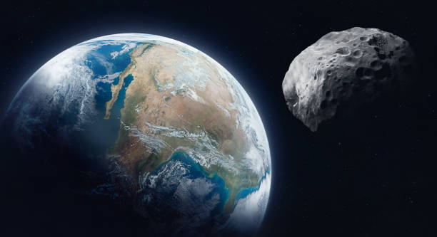 istock Asteroid in space near Earth. Asteroid on orbit of Earth planet. Sci-fi space collage. Elements of this image furnished by NASA 1368257667