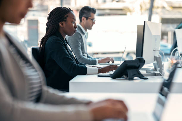 istock Multiaging businesspeople working with computers in a modern startup. 1368257822