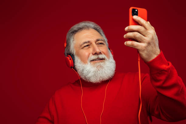 istock Portrait of emotional old man using smart phone 1368257932