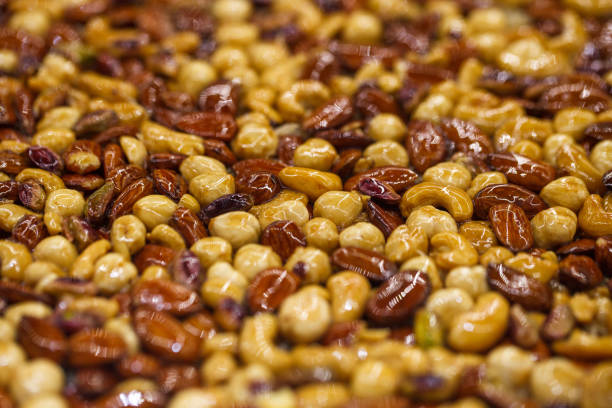 Nuts different in honey sweet syrup, selective focus.