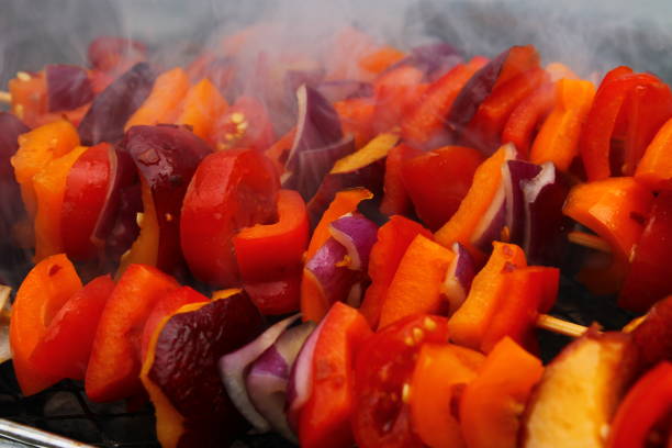 BBQ Platter - Vegetable Skewers consisting of fresh red onions, red and yellow bell peppers, juicy nectarines and cherry tomatoes