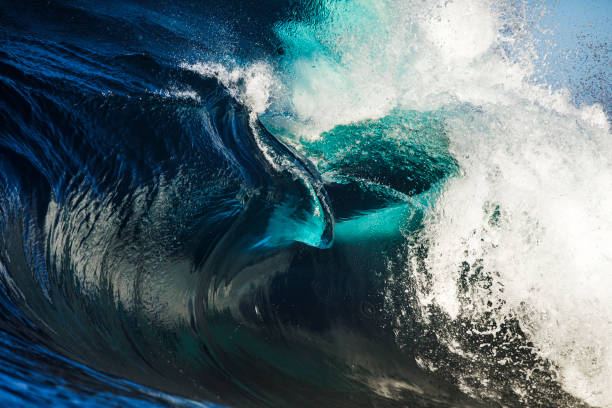 istock Close up of magnificent thrashing deep blue ocean wave 1368263650