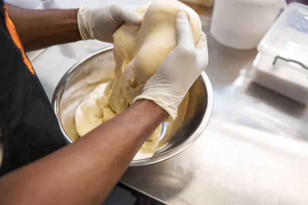 istock Chef in protective clothes cooking at the kitchen 1368263729