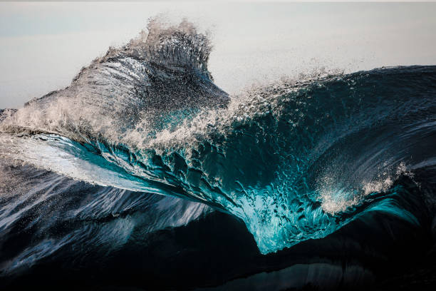 Extreme close up of thrashing emerald ocean waves stock photo