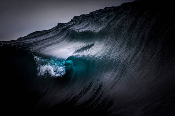 istock Full frame crisp detail of dark blue ocean wave 1368264151