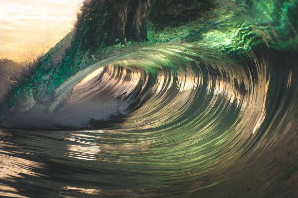 istock Inside the barrel of a vibrant green breaking ocean wave 1368264325