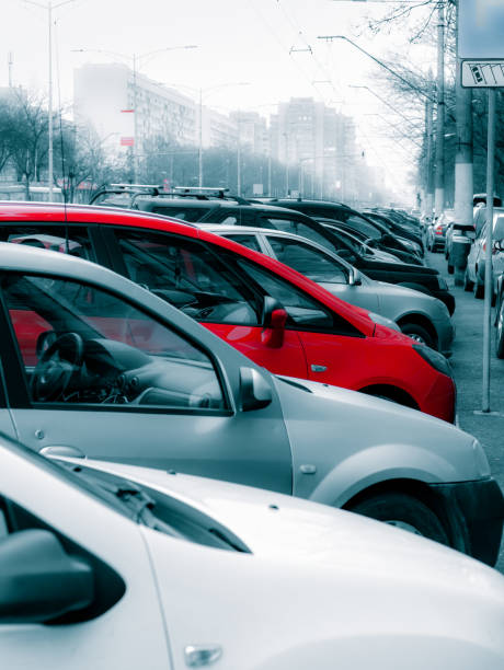 Many cars parked on the sidewalk and street in Bucharest, Many cars parked on the sidewalk and street in Bucharest, Romania. car transporter stock pictures, royalty-free photos & images