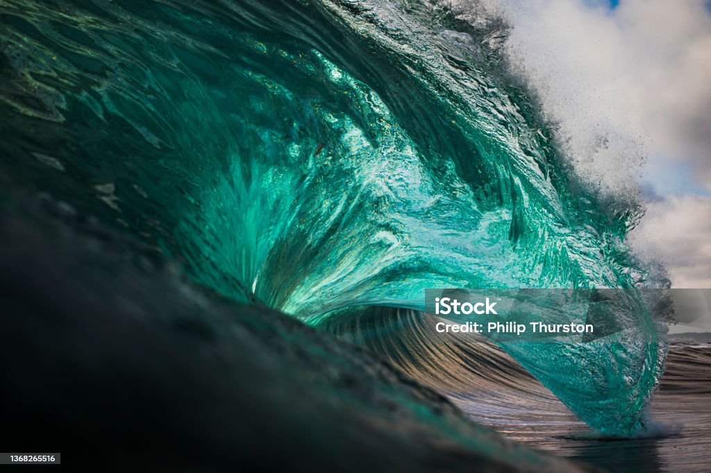 Vibrant emerald green ocean wave Wave - Water Stock Photo