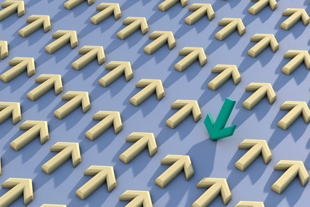 istock Green arrow sign changing direction from yellow arrow sign 1368266933