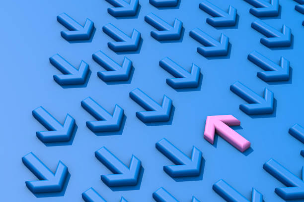 istock Pink arrow sign changing direction from blue arrow sign 1368267030