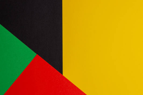 istock Abstract colored paper geometry composition background in black, red, yellow, green colors with copy space for text 1368267237
