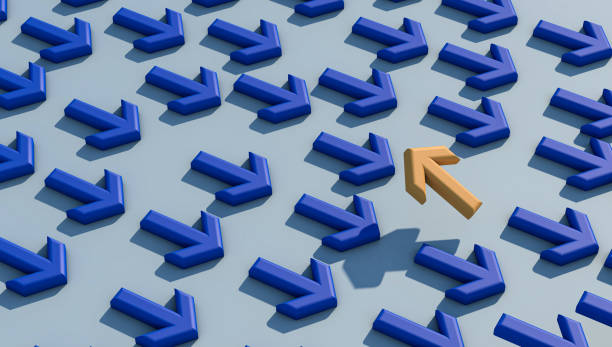 istock Yellow arrow sign changing direction from blue arrow sign 1368267457