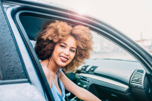 istock Mixed race woman sitting in a car 1368267585