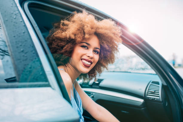 istock Mixed race woman sitting in a car 1368267587
