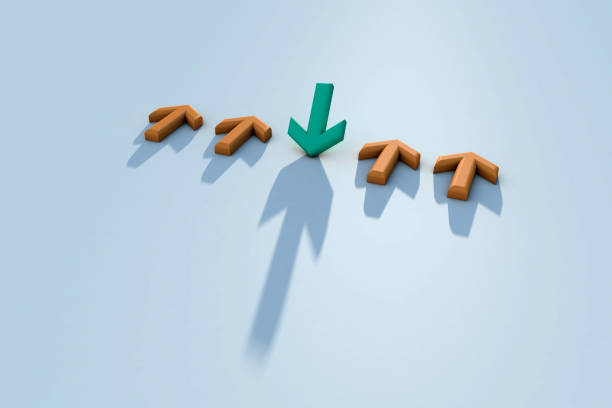 istock Green arrow sign changing direction from yellow arrow sign 1368267609