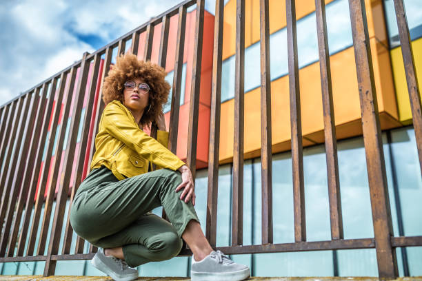 istock Mixed race woman in a multicolor houses background 1368267639
