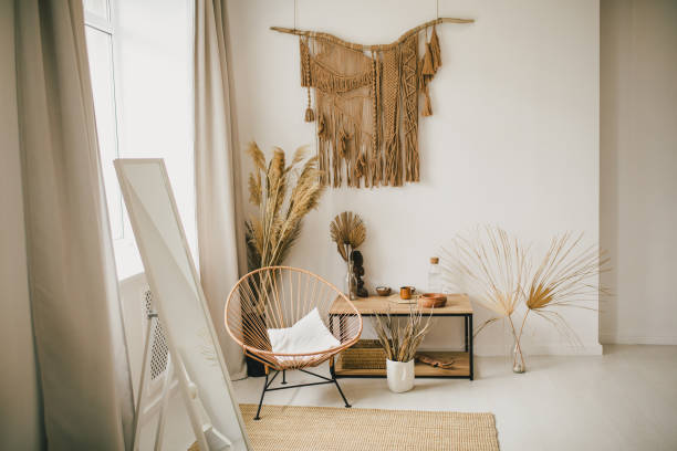 istock Interior in bohemian style with macrame hanging on the wall. 1368269965