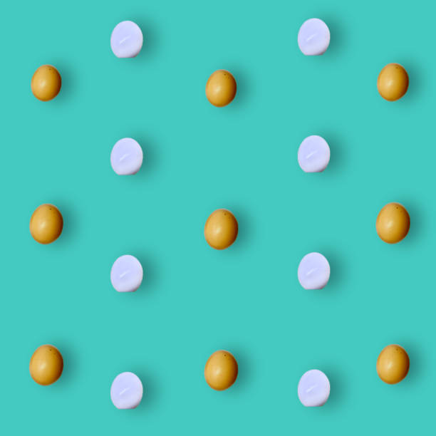 istock Colorful pattern of chicken eggs on turquoise background. Top view. Flat lay. Pop art design 1368270167