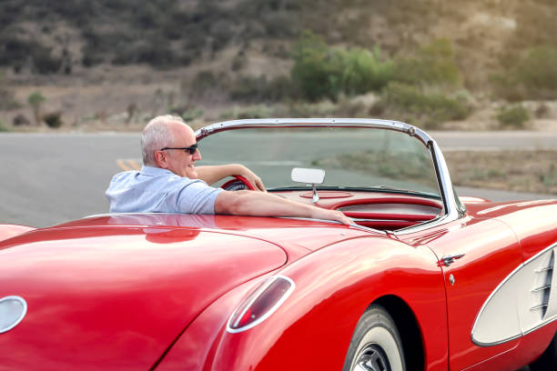 hombre con su deportivo clásico - collectors car mature men transportation lifestyles fotografías e imágenes de stock