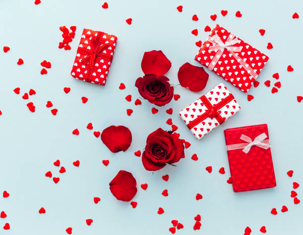 istock Valentines day greeting card template. Gift boxes over blue background. Top view flat lay with copy space 1368271646