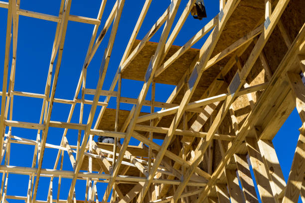 istock Aerial view the timber frame beam framework house stick built home under construction new build with wooden truss 1368272610