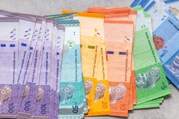 istock Malaysian money spread out on the table, all ringgit banknotes, concept, business economics 1368272654