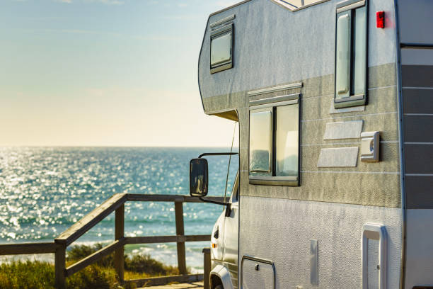 istock Camper rv camping on sea shore, Spain 1368273907
