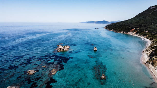 istock Clear blue sea with small islands and green mountains 1368274040