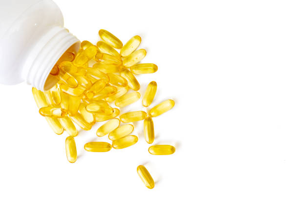 istock Pile of capsules Omega 3 isolated on white background 1368274564