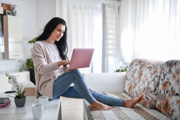 istock Female Beauty Relaxing On Table With Beverages And Laptop 1368275888