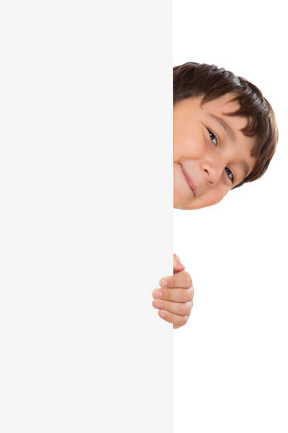 istock Child kid looking at empty blank sign copyspace copy space marketing ad advert isolated on white portrait format 1368280716