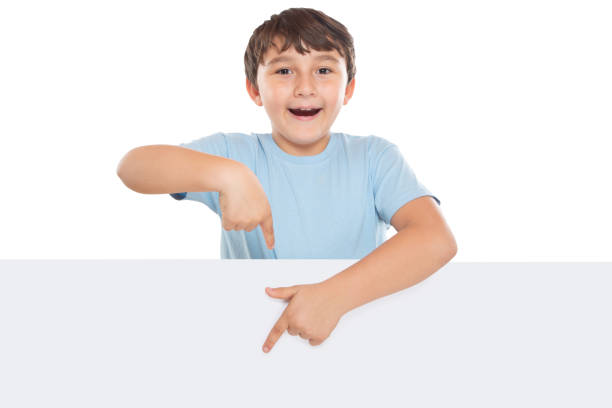 istock Child kid showing pointing on empty blank sign copyspace copy space marketing ad advert isolated on white 1368281350