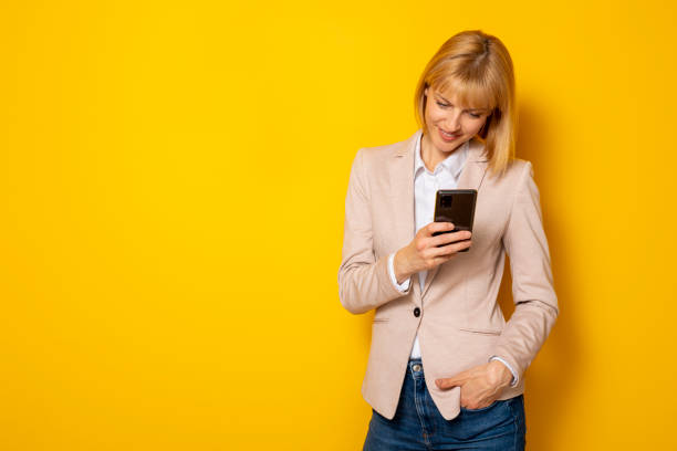 istock Confident businesswoman using smart phone 1368281388