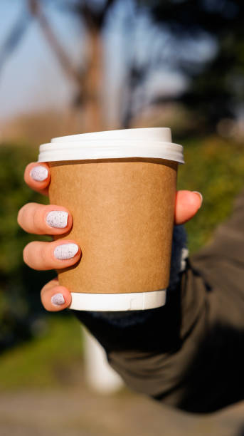 istock Coffee cup in girl's hand 1368281877