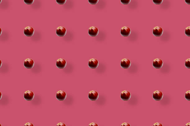 istock Colorful fruit pattern of fresh red apples on pink background. Top view. Flat lay. Pop art design, creative summer concept 1368284196