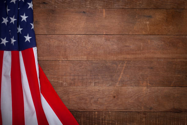 istock American flag on a grunge brown wood textured background 1368284769