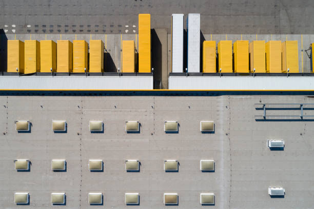 istock Aerial View of Trucks Loading at Logistic Center, Distribution Warehouse 1368291619