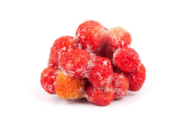 istock frozen strawberries isolated on white background, ice berry 1368292682