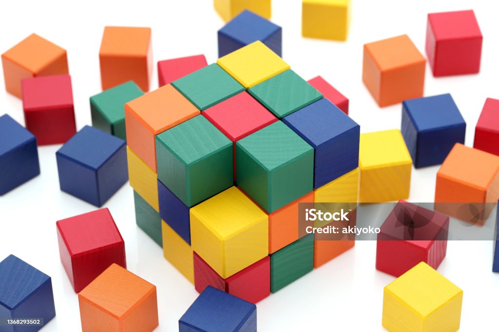 wooden colorful square blocks puzzle small wooden colorful square blocks puzzle on a white background Puzzle Cube Stock Photo
