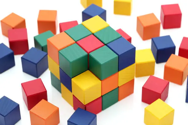 Photo of wooden colorful square blocks puzzle