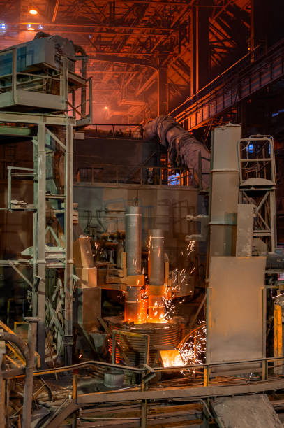 istock Electric arc steelmaking furnace, thick powerful red-hot graphite electrodes 1368294796