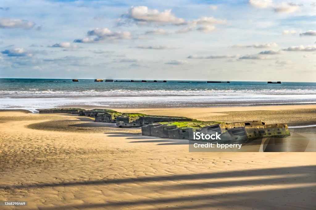Old Ramp Beach Mulberry Harbor Arromanches-les-Bains Normandy France Old Ramp Beach World War 2 Mulberry Harbor Artificial Port Arromanches-les-Bains Normandy France. Through Beach and Ramp 104,000 tons military  supplies in six days D Day Stock Photo