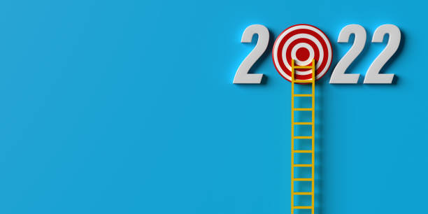 istock Ladder climbing on 2022 target board with large copy space 1368297082