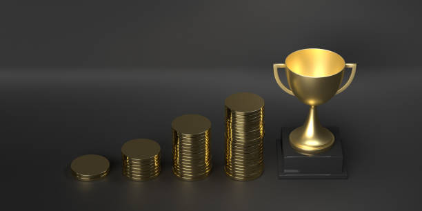 A large collection of trophies is carefully stacked on top of each other upon a sturdy table, showcasing various awards and achievements
