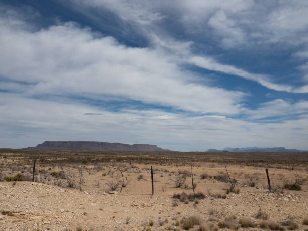istock Chisos Mountains with Rickety Fence in Big Bend National Park, Texas 1368302421