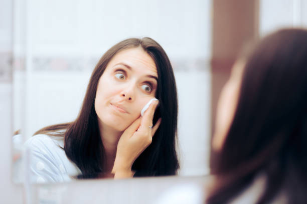 istock Woman Taking Her Make-up of Using a Cotton Wool Ball 1368303415
