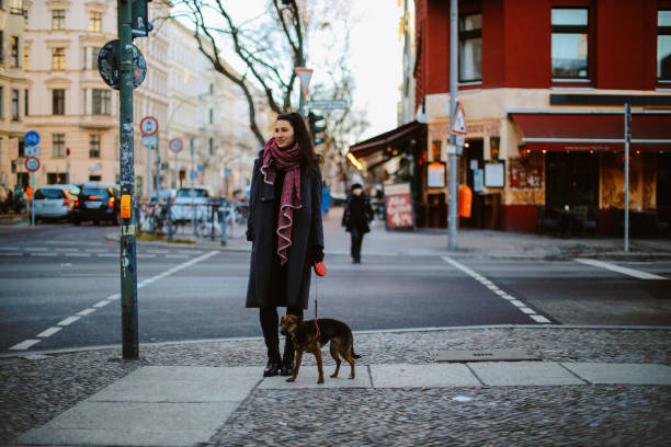 istock woman in Berlin Kreuzberg walking with her pet dog 1368303462